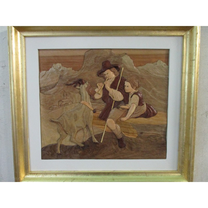 Quadro di scultura in legno “incantatore di caprette e giovane fanciulla”